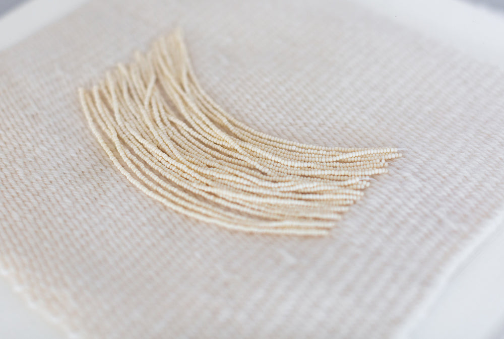 Candice, beaded appliqué, framed weaving, woven wallhanging, wallhanging, woven art, 3d art, unique art, unique wall art, bespoke, bespoke collection, bespoke artwork, bespoke art, bespoke weaving, seven sixteen, 7 16, seven sixteen artist, becky pollard, denver artist, colorado artist, fiber artist, woven art, woven artwork, becky seven sixteen, seven sixteen becky, beaded detail, beading detail, beaded weaving, weaving with beading, tone on tone art, cream art